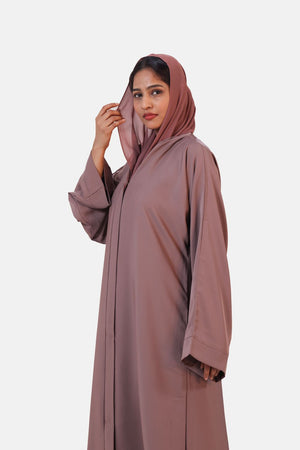 Soft peach abaya with simple modern silhouette and comfortable flowy fabric