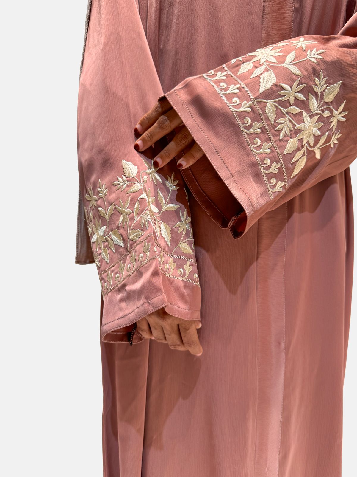 Modern peach abaya for women with delicate white embroidery on sleeves