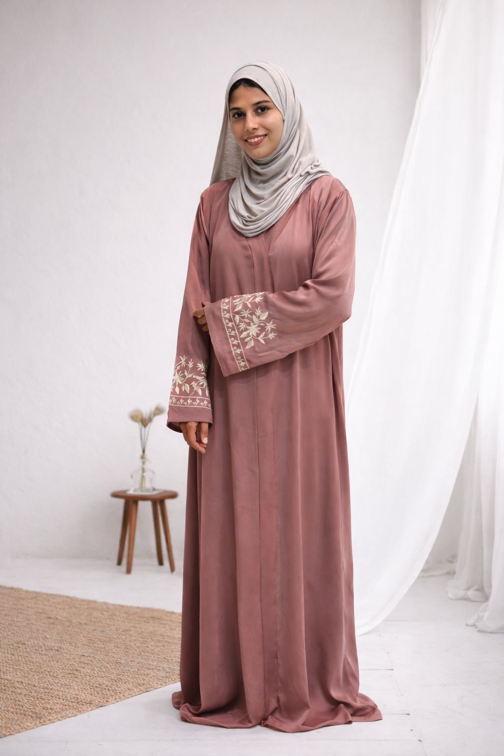 Peach modest abaya with white embroidered sleeves and flowing fabric
