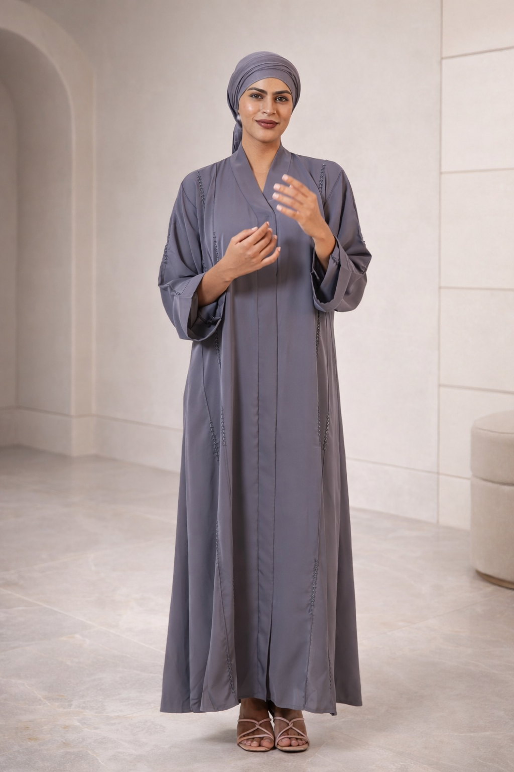 Elegant charcoal grey abaya with subtle vertical stitching and wide sleeves