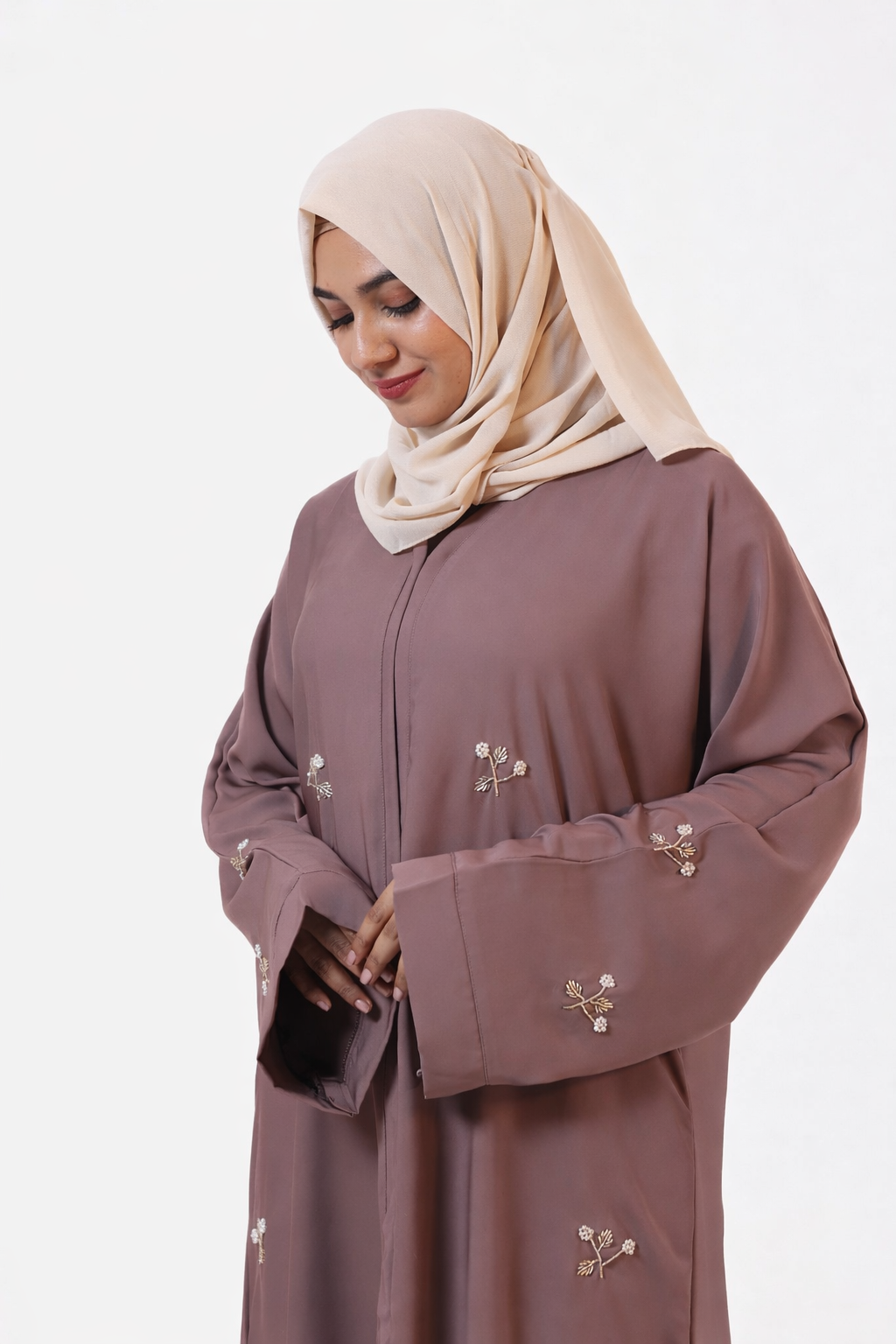 Sophisticated modest abaya featuring artisanal handwork and elegant drape

