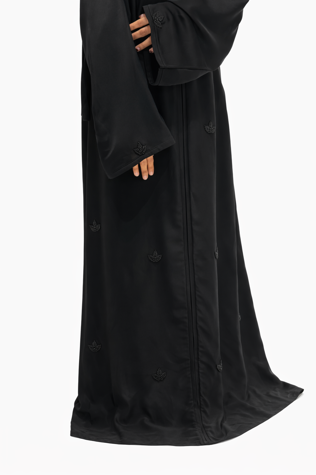 Luxury black abaya featuring all-over beadwork motifs and flowing modest design