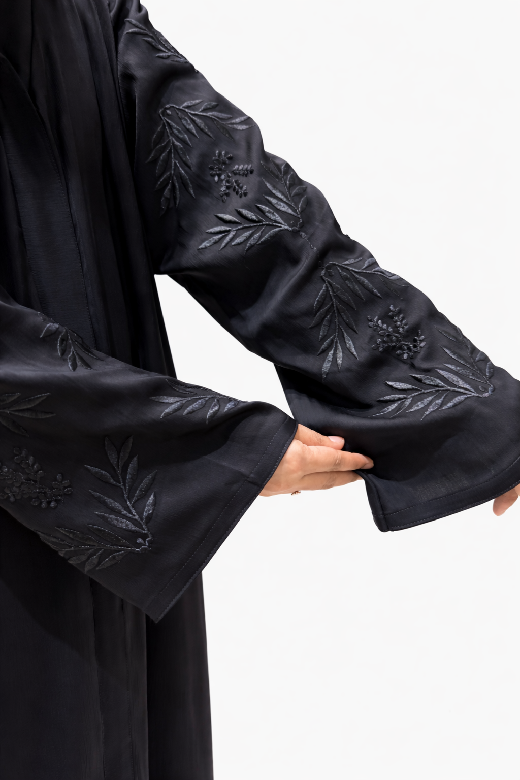 Premium black abaya with floral sleeve detailing and relaxed full-length fit